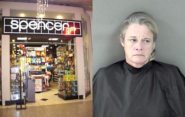 Woman places merchandise in pocket at Vero Beach Spencer's.