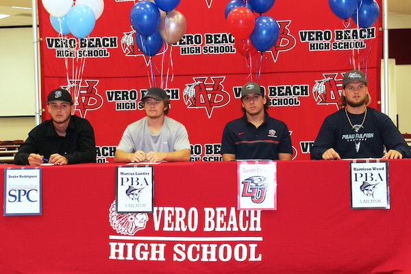 Drake Rodriguez, Marcus Lantier, Garrette Cooper, and Harrison Wood signed letters of intent at Vero Beach High School.