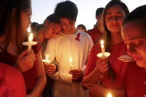 Students gather during a vigil for the victims of the shooting at Marjory Stoneman Douglas High School, in Parkland, Florida.