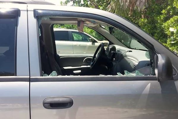 Window smashed at beach.