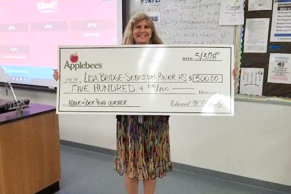 Vero Beach Applebee's Presents $500 to Above and "BEE"yond Teacher Contest Winner.
