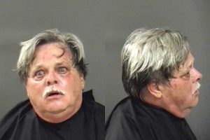 Man blocks doorway at a Vero Beach restaurant.