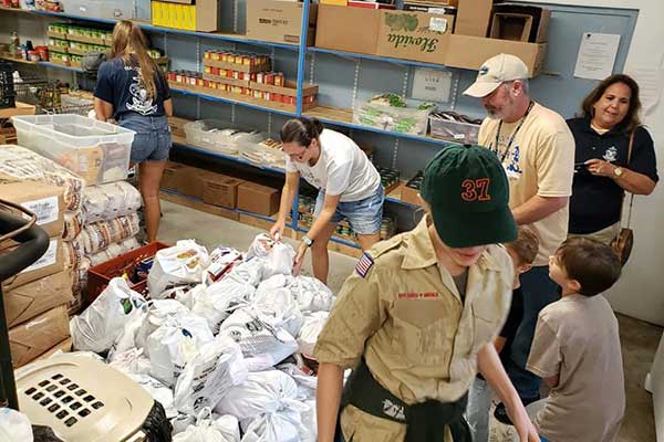 Boy Scouts help in fight against hunger during food drive in Sebastian, Florida.
