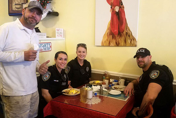 Shannon McClain bought breakfast for three police officers at the Hen House in Sebastian, Florida.