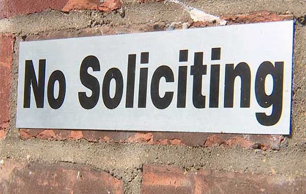Sebastian councilwoman leaves her business card on a no soliciting sign.