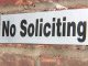 Sebastian councilwoman leaves her business card on a no soliciting sign.