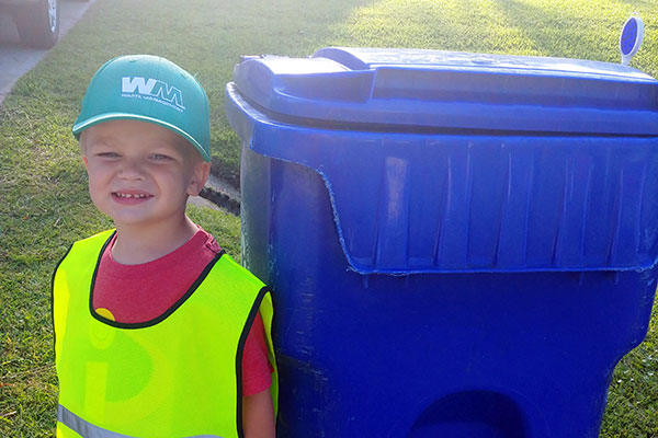 Roman, 3, started his own garbage can retrieval business.