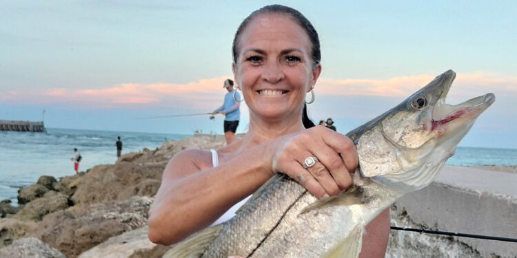 Angie Clifford with a snook at the Sebastian Inlet.