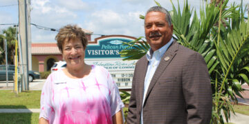 The photo features Cheryl Thibault, President of Sebastian River Area Chamber of Commerce, alongside Fred Jones, the Mayor of Sebastian.