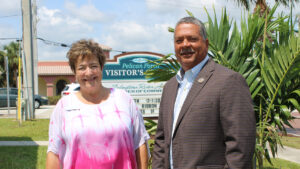 The photo features Cheryl Thibault, President of Sebastian River Area Chamber of Commerce, alongside Fred Jones, the Mayor of Sebastian.