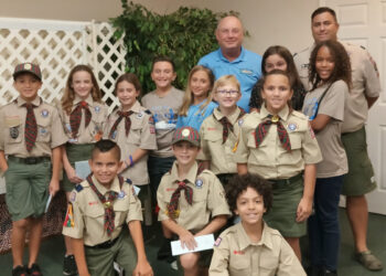 Councilman Ed Dodd (in the blue shirt) answers questions from Sebastian Cub Scouts