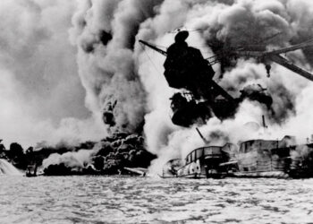 The infamous Japanese attack on Pearl Harbor, Hawaii, is shown in this Dec. 7, 1941 file photo. The USS Arizona is pictured in flames after being hit. (Credit: AP)