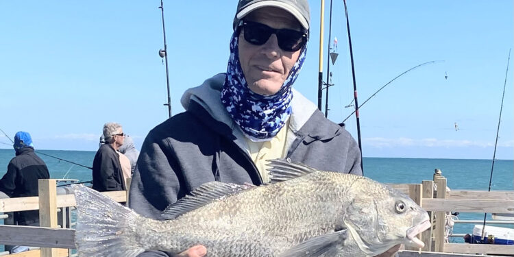 Kirby Kitchener with a black drum at the Sebastian Inlet