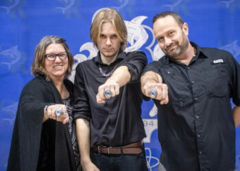 Holly Hamilton (left) with her son Patrick (center) and husband James (right)