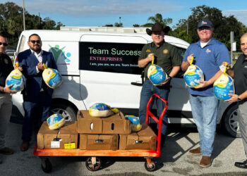 Team Success Enterprises Inc. and the Indian River County Sheriff's Office partnered to deliver Thanksgiving meals