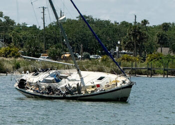 Abandoned sailboat following a storm.