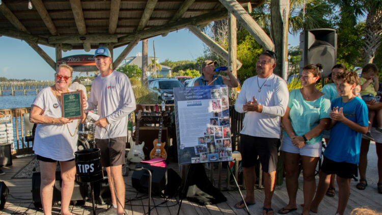 Mel Fisher Days: For this very special 40th Anniversary of the Atocha Motherlode, the annual Mel Fisher Lifetime Achievement Award was presented to Taffi Fisher Abt on Saturday during Mel Fisher Days. Each year the award is presented “to a person who has shown immense perseverance in following their quest in life.” (Left to right: Taffi Fisher Abt accepts the award presented by her family, Melvin Abt, Joshua Abt, Nichole Johanson, and Jace Johanson) (Photo Credit: Jim Wilson)