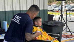 Indian River County Sheriff's Office and Team Success team up with local barbers to provide free haircuts and braids for kids before the school year.