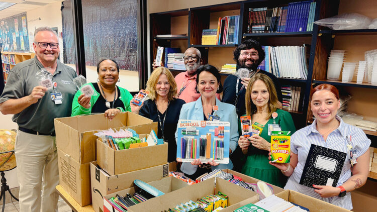 Team members from Orlando Health Sebastian River Hospital and staff from Sebastian Elementary celebrate the donation of 350 wired earbuds, additional school supplies and one year’s worth of medical supplies for the school clinic.