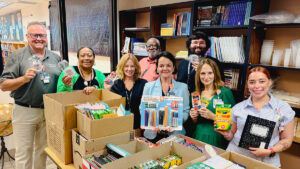 Team members from Orlando Health Sebastian River Hospital and staff from Sebastian Elementary celebrate the donation of 350 wired earbuds, additional school supplies and one year’s worth of medical supplies for the school clinic.