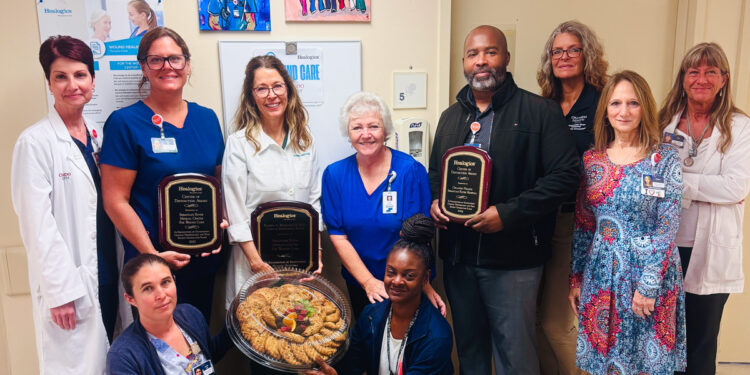 Orlando Health Melbourne Hospital and Orlando Health Sebastian River Hospital were among four Orlando Health Healogics wound care centers to receive the Center of Distinction award for excellent care. Wound care center staff from Sebastian River Hospital are joined by hospital leadership to celebrate their third year in a row as a Healogics Center of Distinction. Back row, from left to right, Christina McGuirk, CNO; Dana Miller, RN; Dawn Davidson-Jockovich, Medical Director; Cathy Bahrakis, Patient Navigator; Chris Davis, Program Director; Denise Schmidt, Life Safety Specialist; Valerie Rignola, HR; Lori Jagniecki, Infection Preventionist. Front row, left to right: Jennifer Arma, LPN; Keneha Barber, Environmental Services Supervisor.