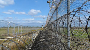 A federal appeals court expedited a legal battle over a controversial Alligator Alcatraz center, but a ruling is unlikely before early 2026.