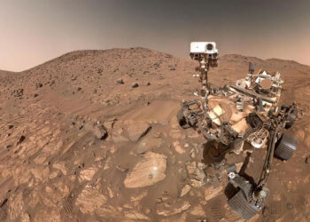 NASA’s Perseverance rover captured this selfie, stitched together from 62 individual images, on July 23, 2024, in Mars’ Jezero Crater. The arrowhead-shaped rock nicknamed “Cheyava Falls,” visible to the left of the rover near the image’s center, contains chemical features that could indicate ancient microscopic life on the Red Planet, though further study is needed.