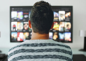 Americans increasingly stream new movies at home over theaters, highlighting post-pandemic viewing shifts. (Photo by Mohamed Hassan)