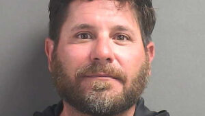 Police arrested a man accused of pointing a handgun at several juveniles and threatening to shoot them. (VSO)