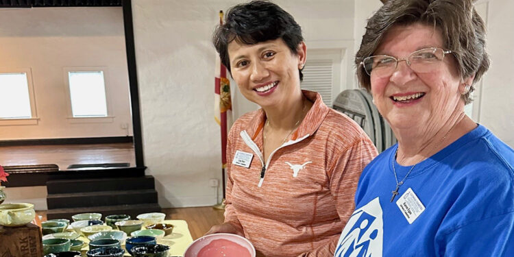 Samaritan Center volunteers: Lisa Parr (left) and Karen Egan (right) show off one-of-a-kind Soup Bowl pottery made by potters at Indian River Clay to help homeless families.