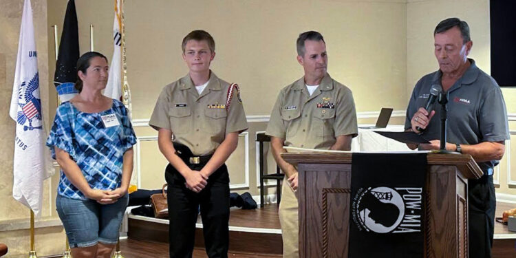 From left to right: Mrs. Elizabeth Ward, Cadet Kyle Ward, CDR (ret) Peter Bissonnette, and Lt. Col. (ret) Jay Torres reading the Cadet of the Month citation. (Photo: Kim Palazzolo, MOAA)
