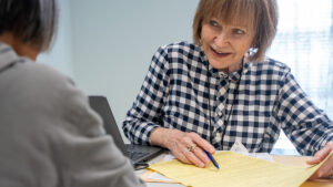 Ruth Durkee-Killinger assists a VITA client, helping them navigate the tax process and maximize their refund. (United Way)