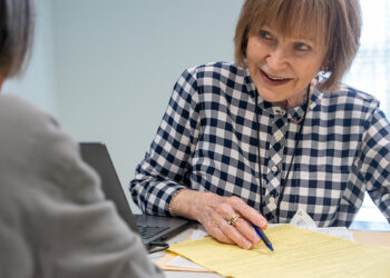Ruth Durkee-Killinger assists a VITA client, helping them navigate the tax process and maximize their refund. (United Way)