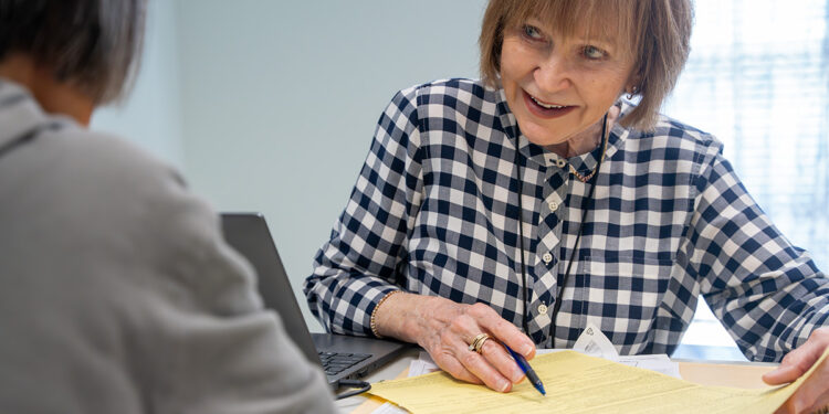 Ruth Durkee-Killinger assists a VITA client, helping them navigate the tax process and maximize their refund. (United Way)