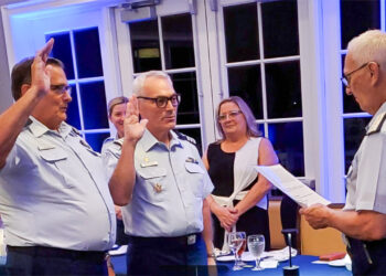 Oath of office - L to R Jim A. Vaughn, Flotilla Commander; Daniel W. Blankenship, Flotilla Vice Commander; Administering the oath, Gary P. Barth, Immediate Past Flotilla Commander (Credit: Auxiliarist T.G. McCarty)