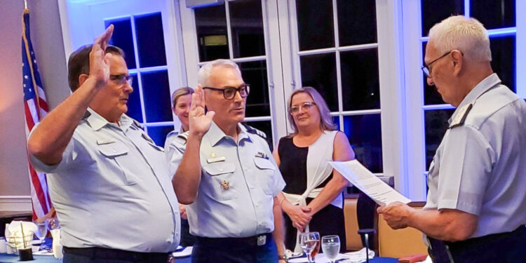 Oath of office - L to R Jim A. Vaughn, Flotilla Commander; Daniel W. Blankenship, Flotilla Vice Commander; Administering the oath, Gary P. Barth, Immediate Past Flotilla Commander (Credit: Auxiliarist T.G. McCarty)
