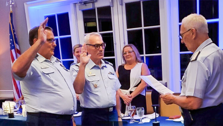 Oath of office - L to R Jim A. Vaughn, Flotilla Commander; Daniel W. Blankenship, Flotilla Vice Commander; Administering the oath, Gary P. Barth, Immediate Past Flotilla Commander (Credit: Auxiliarist T.G. McCarty)