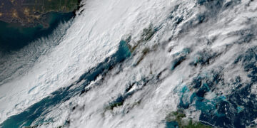 Sunday's flurries are due to a strong cold front colliding with moisture from the Gulf of Mexico (NOAA)