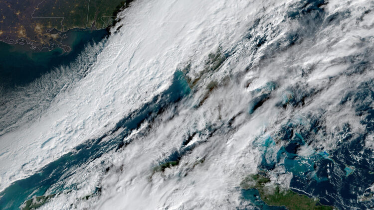 Sunday's flurries are due to a strong cold front colliding with moisture from the Gulf of Mexico (NOAA)