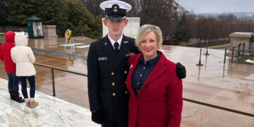 Cadet James Henry Adams Davey (L) stands with his mother, Susan Adams, at the Tomb of the Unknown Soldier