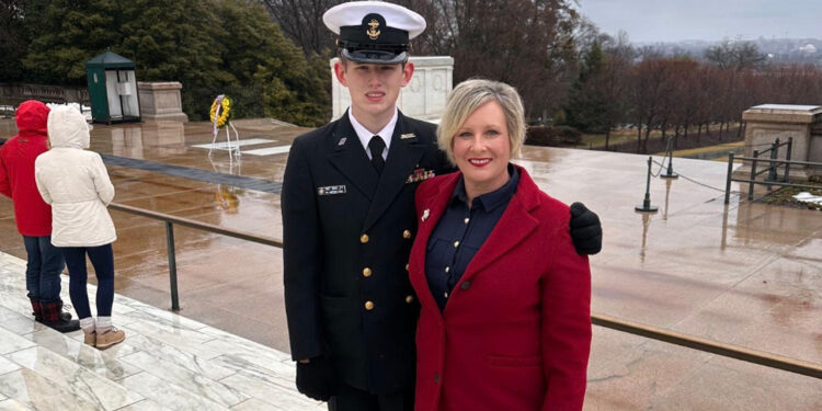 Cadet James Henry Adams Davey (L) stands with his mother, Susan Adams, at the Tomb of the Unknown Soldier