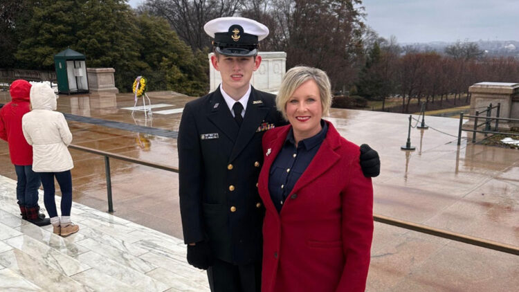 Cadet James Henry Adams Davey (L) stands with his mother, Susan Adams, at the Tomb of the Unknown Soldier