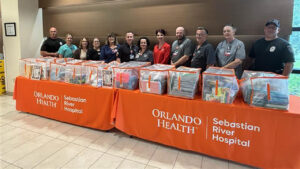 Hospital staff and Sebastian police officers sort and prepare 3,558 donated school supplies for local K-8 students